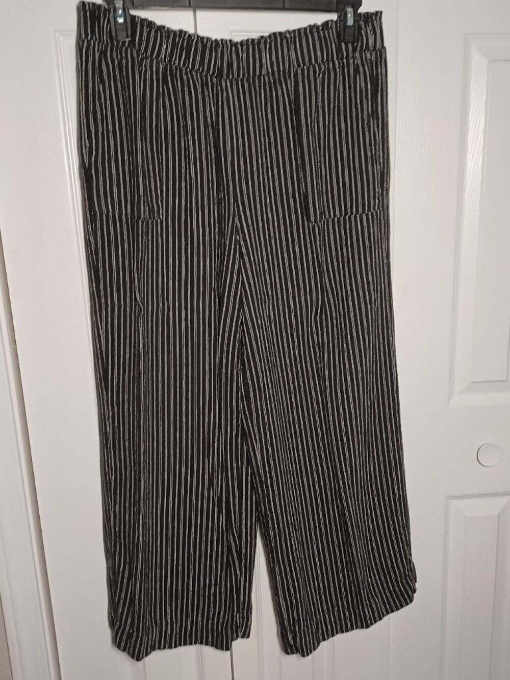 The Women’s Time and Tru Black and White Striped Wide Leg Pants in size L 12-14